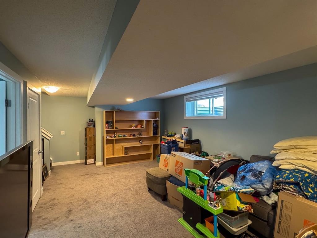 122 Midtown Boulevard Sw, Airdrie, AB - Indoor Photo Showing Other Room