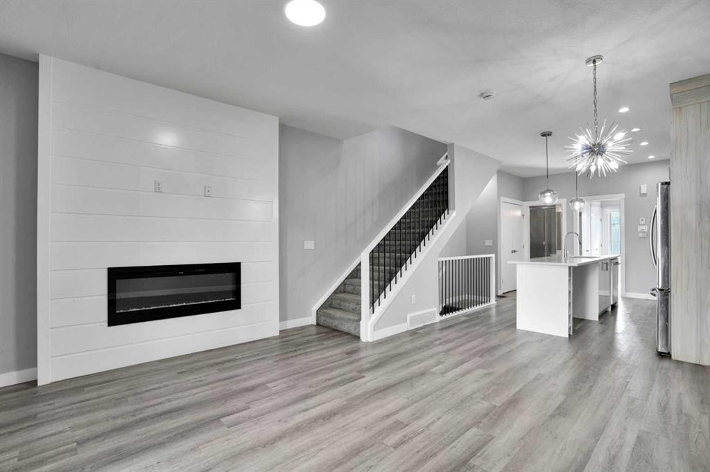 410-95 Skyview Close Ne, Calgary, AB - Indoor Photo Showing Living Room With Fireplace