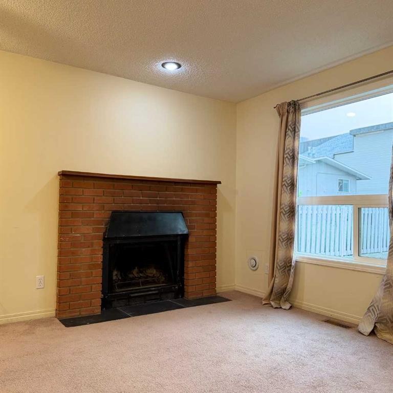 411 6 Street Ne, Calgary, AB - Indoor Photo Showing Living Room With Fireplace
