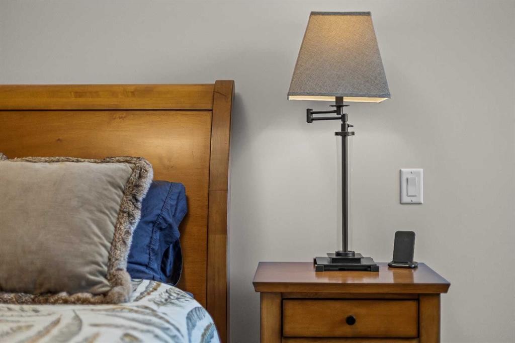 307-1505 Spring Creek Gate, Canmore, AB - Indoor Photo Showing Bedroom
