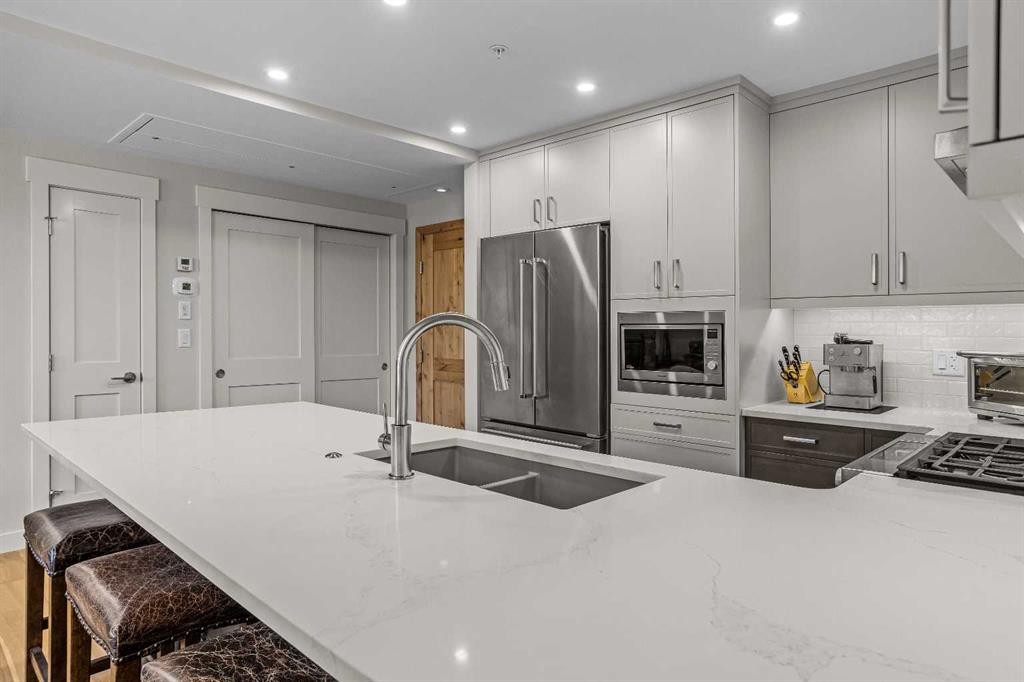 307-1505 Spring Creek Gate, Canmore, AB - Indoor Photo Showing Kitchen With Double Sink With Upgraded Kitchen
