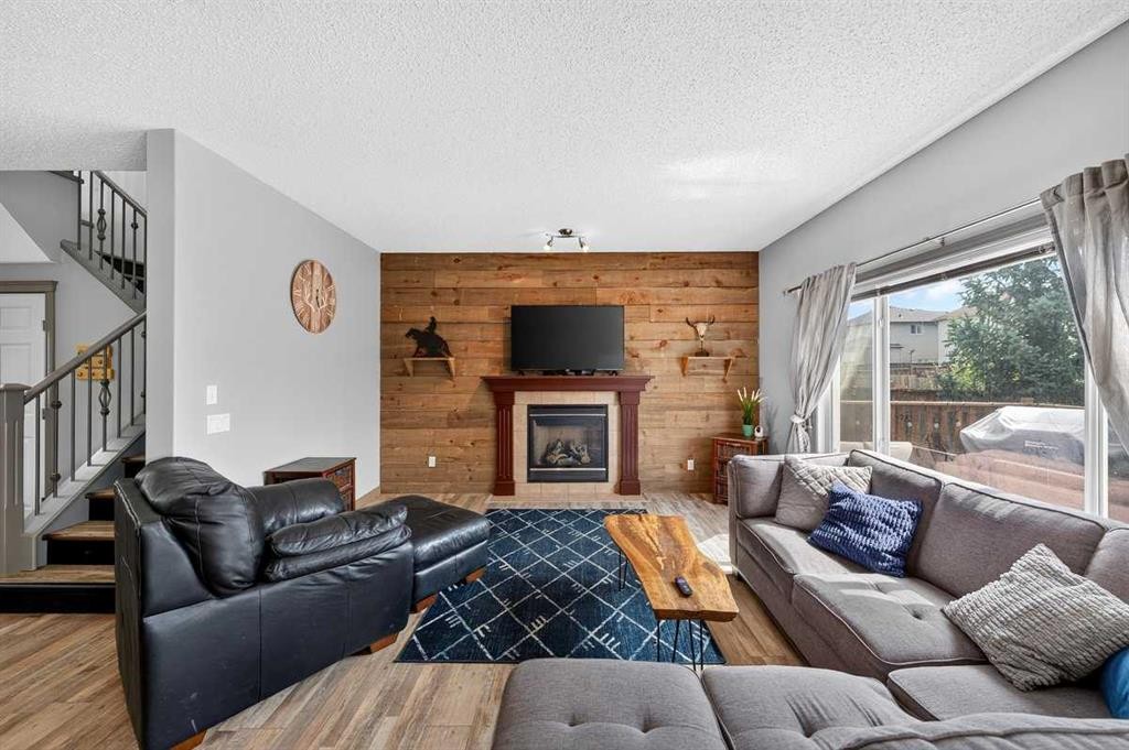 363 Evanston View Nw, Calgary, AB - Indoor Photo Showing Living Room With Fireplace