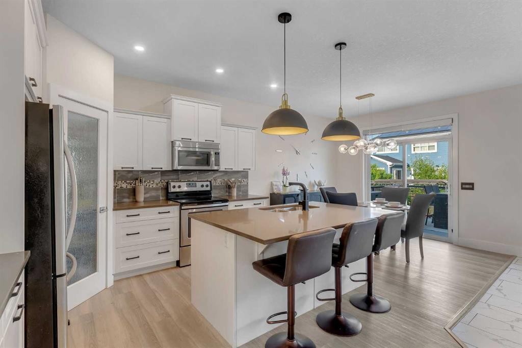 156 Rainbow Falls Heath, Chestermere, AB - Indoor Photo Showing Kitchen With Upgraded Kitchen