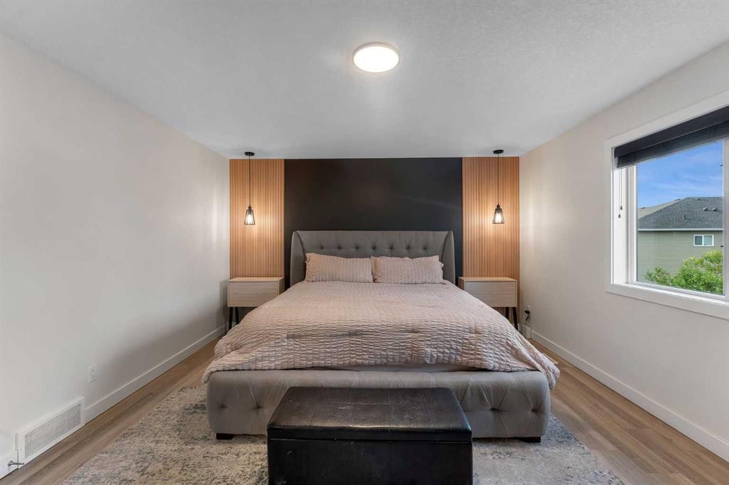156 Rainbow Falls Heath, Chestermere, AB - Indoor Photo Showing Bedroom