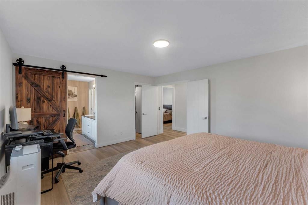 156 Rainbow Falls Heath, Chestermere, AB - Indoor Photo Showing Bedroom