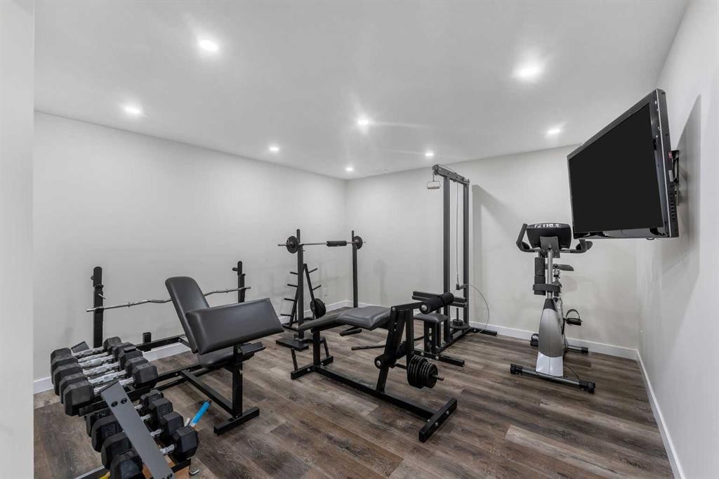 156 Rainbow Falls Heath, Chestermere, AB - Indoor Photo Showing Gym Room