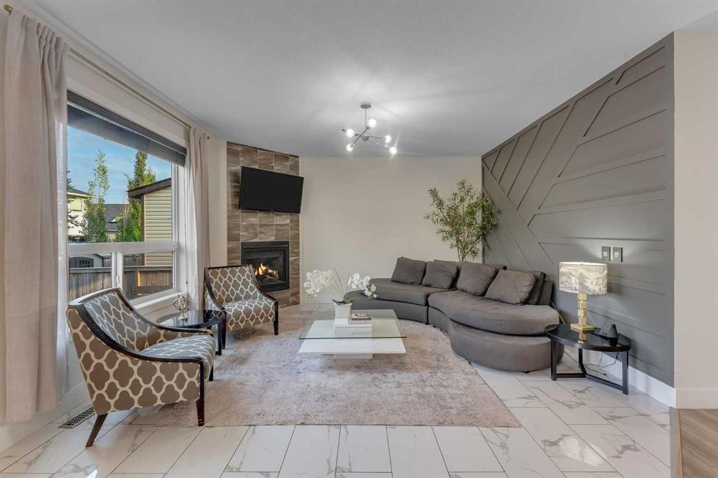 156 Rainbow Falls Heath, Chestermere, AB - Indoor Photo Showing Living Room With Fireplace