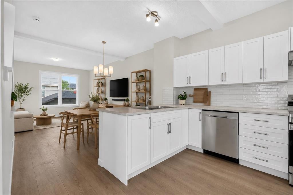 134 New Brighton Landing Se, Calgary, AB - Indoor Photo Showing Kitchen With Double Sink