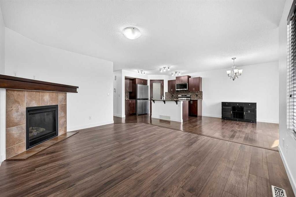 377 Panora Way Nw, Calgary, AB - Indoor Photo Showing Living Room With Fireplace