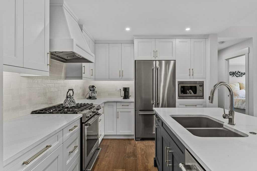 311-1315 Spring Creek Gate, Canmore, AB - Indoor Photo Showing Kitchen With Double Sink With Upgraded Kitchen