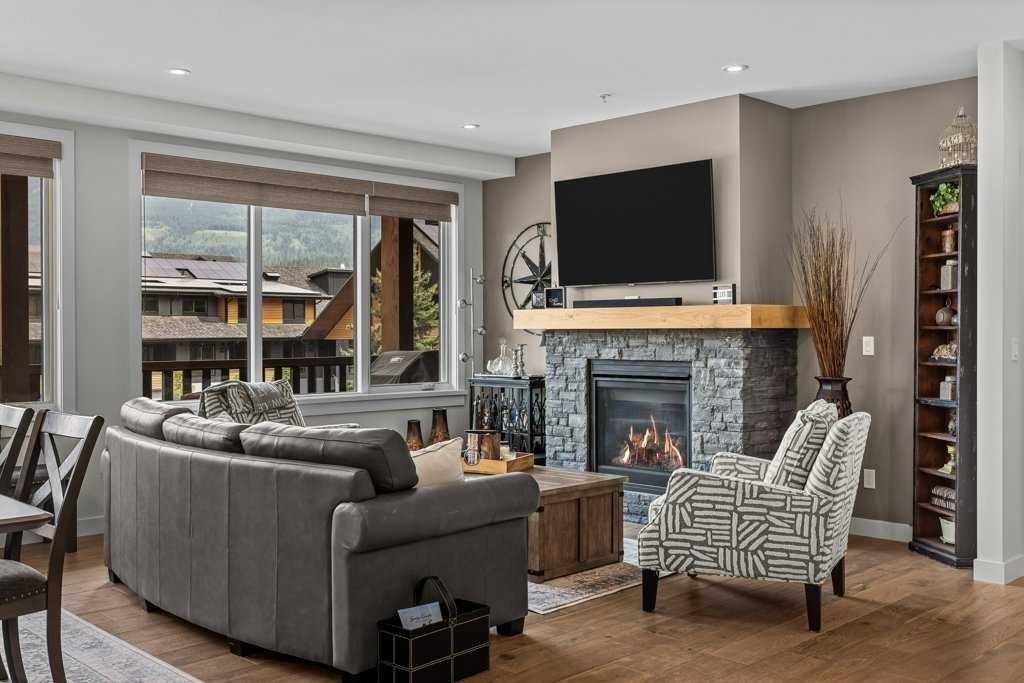 311-1315 Spring Creek Gate, Canmore, AB - Indoor Photo Showing Living Room With Fireplace