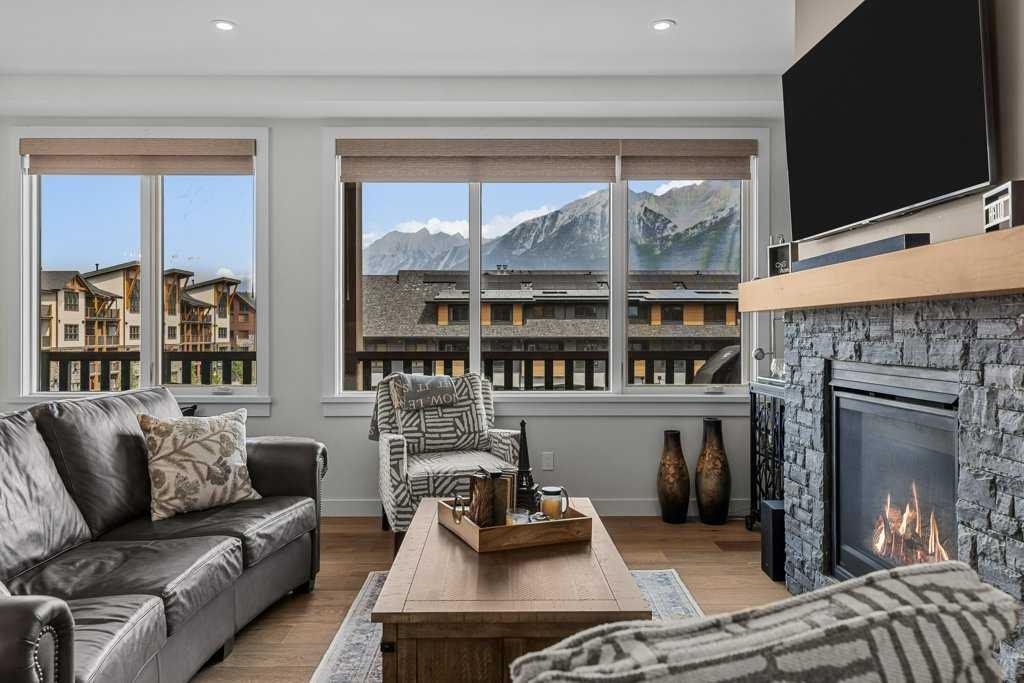 311-1315 Spring Creek Gate, Canmore, AB - Indoor Photo Showing Living Room With Fireplace