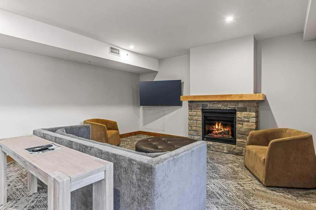 311-1315 Spring Creek Gate, Canmore, AB - Indoor With Fireplace