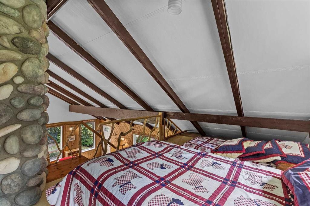 9 Des Arcs Road, Lac Des Arcs, AB - Indoor Photo Showing Bedroom