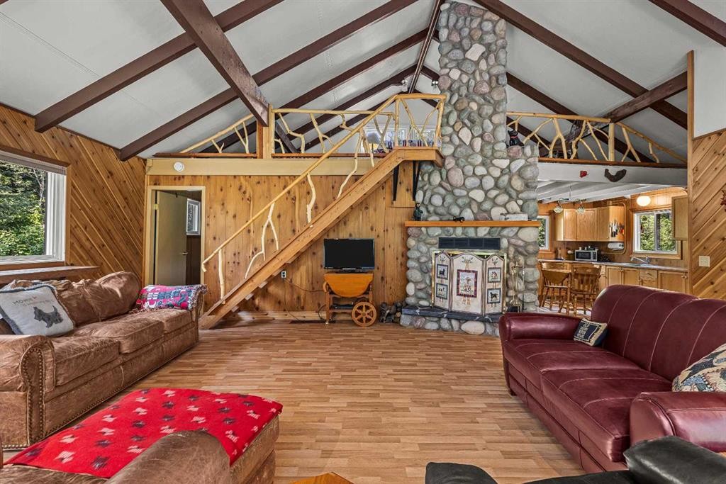9 Des Arcs Road, Lac Des Arcs, AB - Indoor Photo Showing Living Room With Fireplace