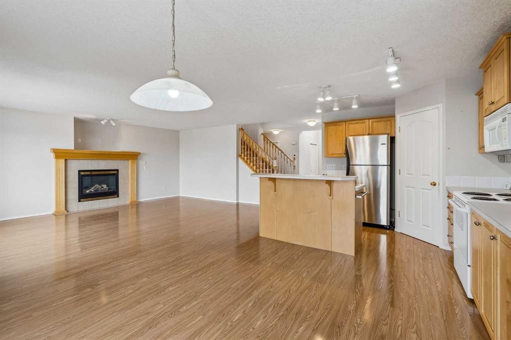 41 Panorama Hills Way Nw, Calgary, AB - Indoor Photo Showing Kitchen With Fireplace With Double Sink