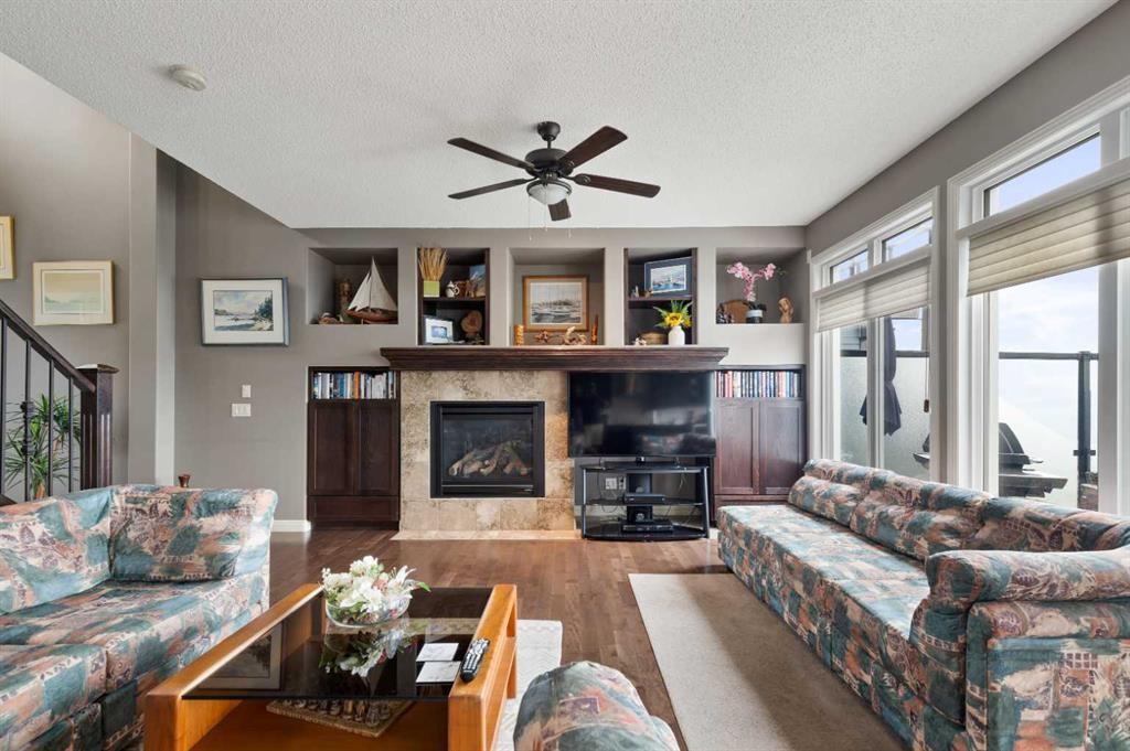 159 Sunset View, Cochrane, AB - Indoor Photo Showing Living Room With Fireplace