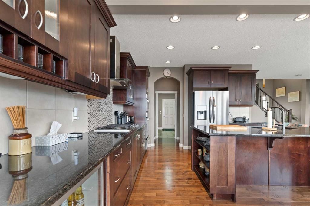 159 Sunset View, Cochrane, AB - Indoor Photo Showing Kitchen With Stainless Steel Kitchen With Upgraded Kitchen