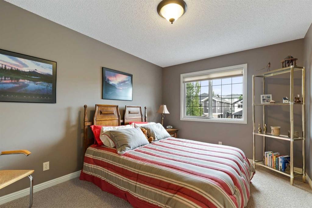 159 Sunset View, Cochrane, AB - Indoor Photo Showing Bedroom