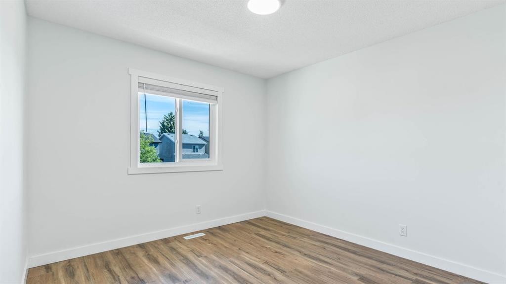15 Taraglen Court Ne, Calgary, AB - Indoor Photo Showing Other Room