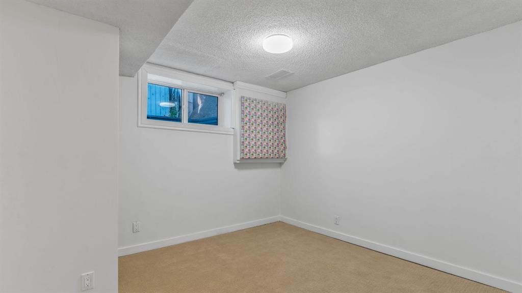 15 Taraglen Court Ne, Calgary, AB - Indoor Photo Showing Other Room