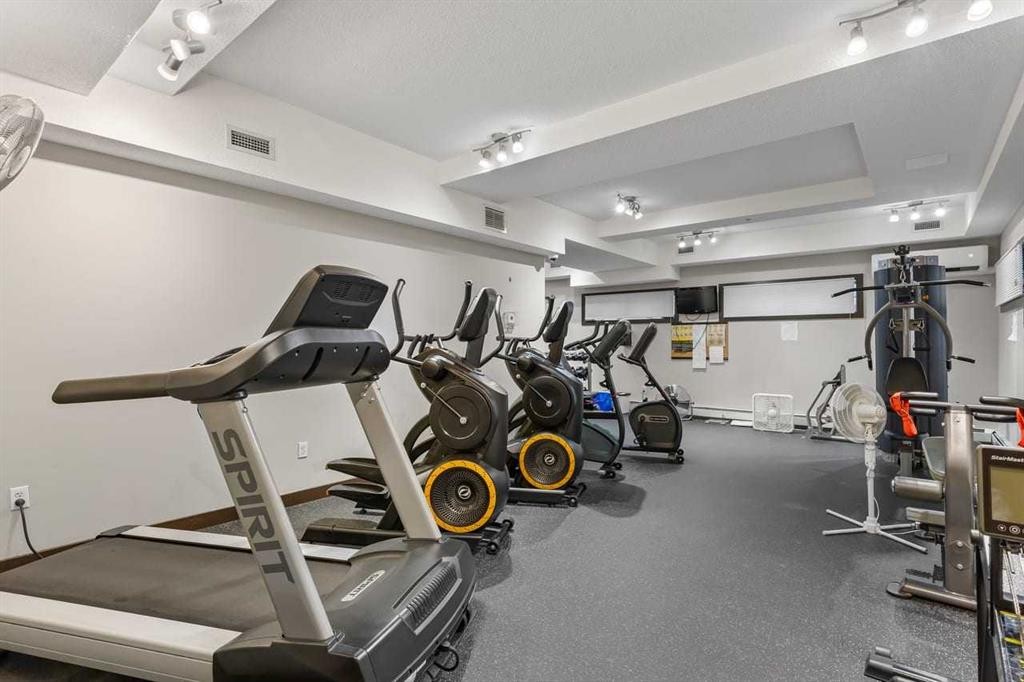320-11 Millrise Drive Sw, Calgary, AB - Indoor Photo Showing Gym Room