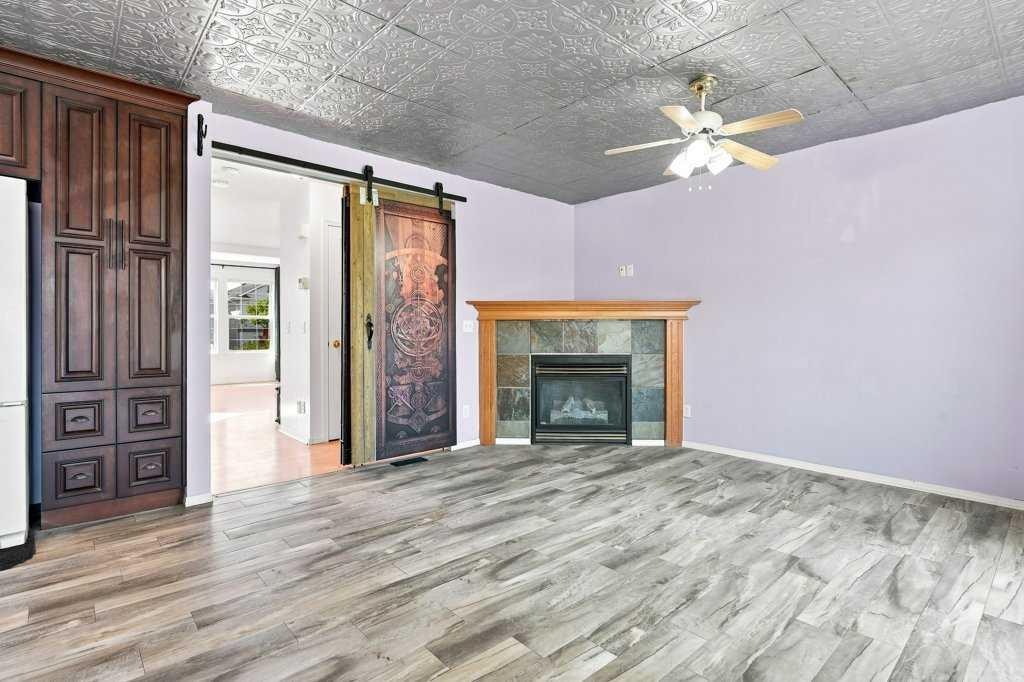 100 Coventry Road Ne, Calgary, AB - Indoor With Fireplace