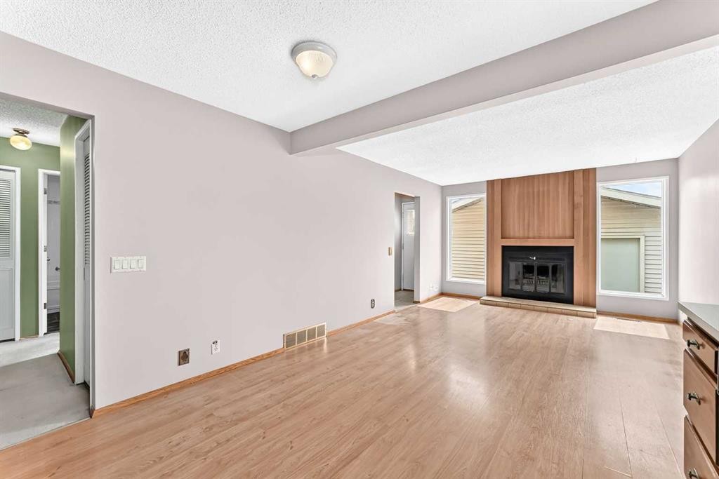 128 Erin Woods Drive Se, Calgary, AB - Indoor With Fireplace