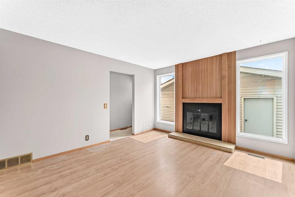 128 Erin Woods Drive Se, Calgary, AB - Indoor With Fireplace