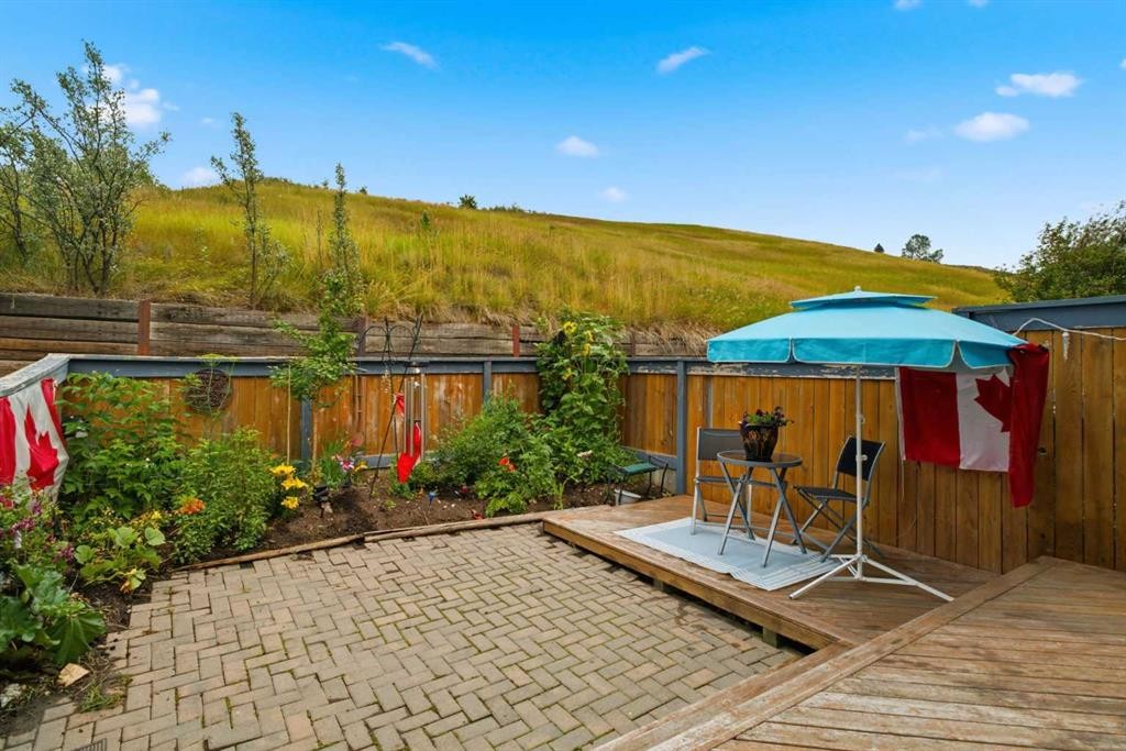 12-800 Bowcroft Place, Cochrane, AB - Outdoor With Deck Patio Veranda