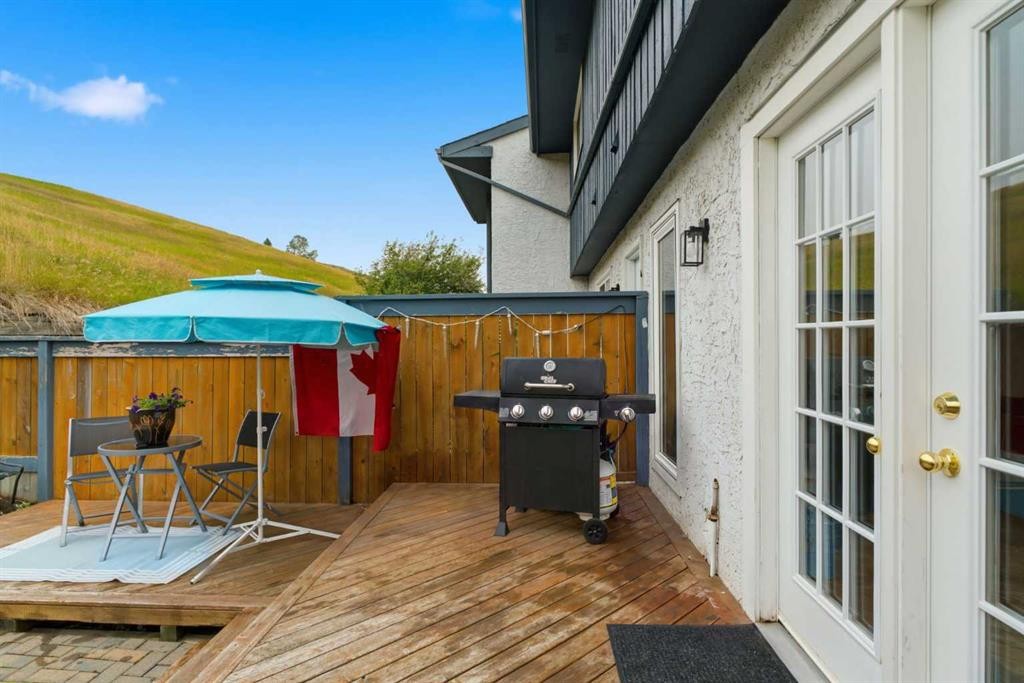 12-800 Bowcroft Place, Cochrane, AB - Outdoor With Deck Patio Veranda With Exterior