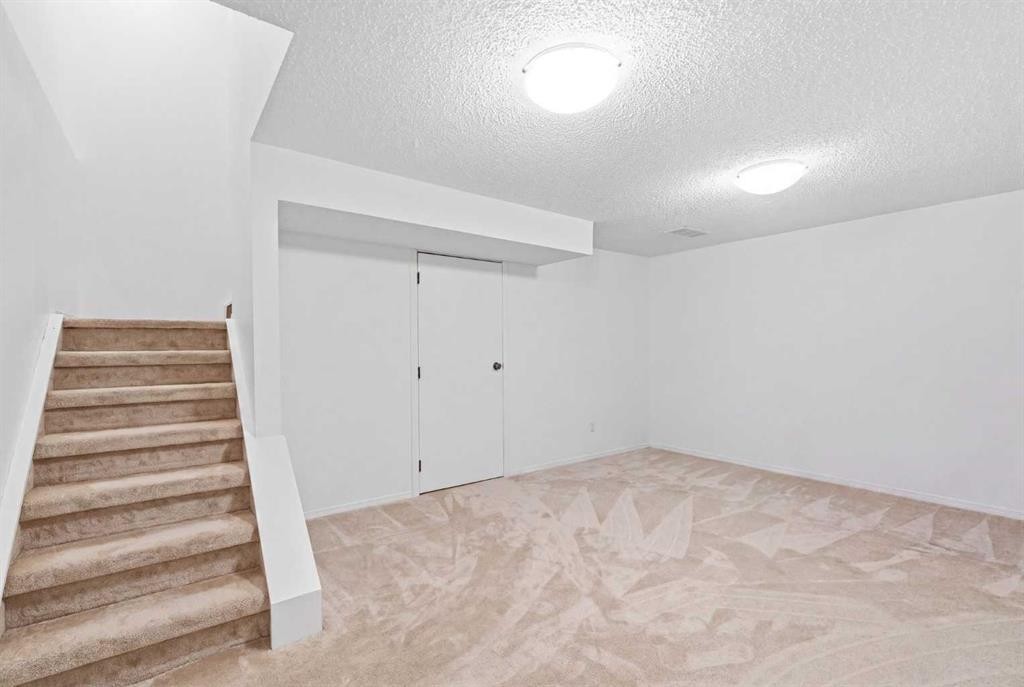 12-800 Bowcroft Place, Cochrane, AB - Indoor Photo Showing Other Room