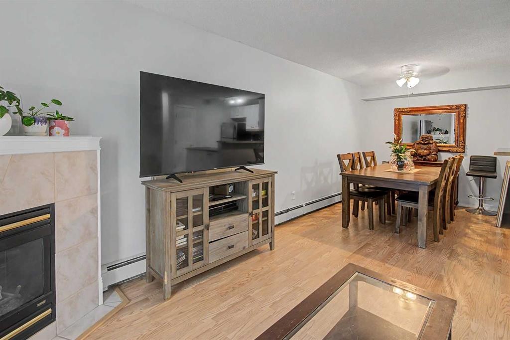 101-7724 Bowness Road Nw, Calgary, AB - Indoor With Fireplace