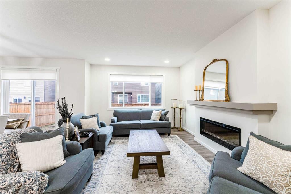 156 Savanna Drive Ne, Calgary, AB - Indoor Photo Showing Living Room With Fireplace