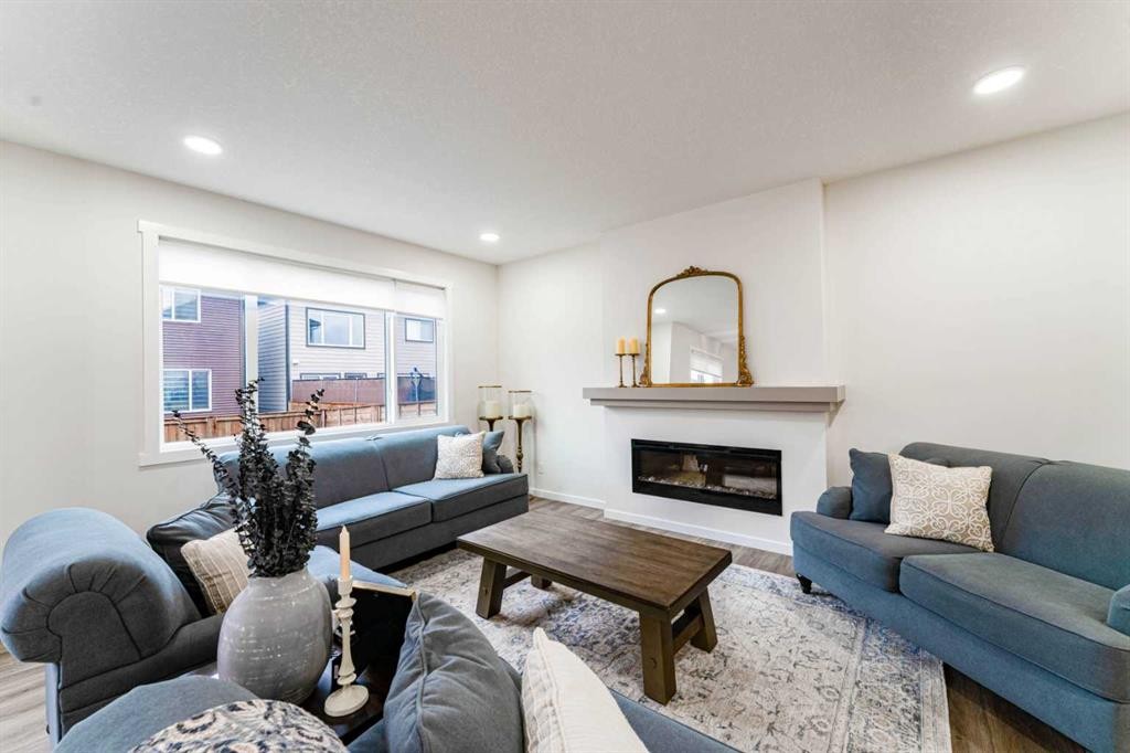 156 Savanna Drive Ne, Calgary, AB - Indoor Photo Showing Living Room With Fireplace