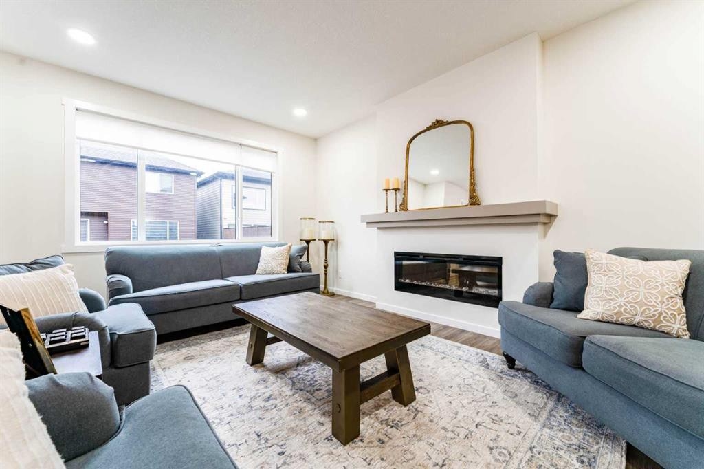 156 Savanna Drive Ne, Calgary, AB - Indoor Photo Showing Living Room With Fireplace