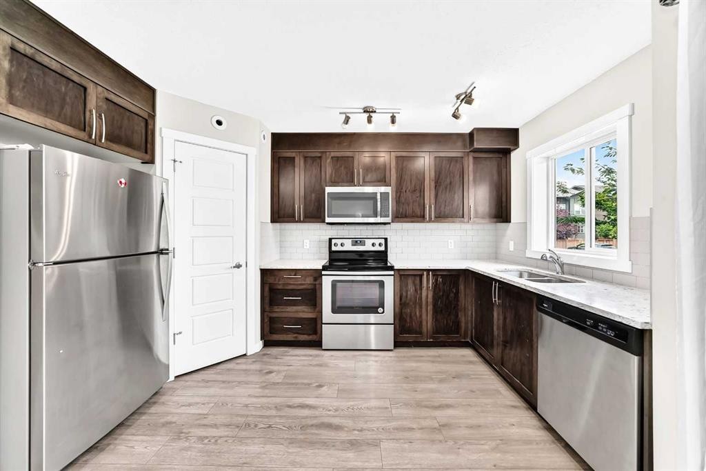 220 Red Embers Way Ne, Calgary, AB - Indoor Photo Showing Kitchen With Double Sink