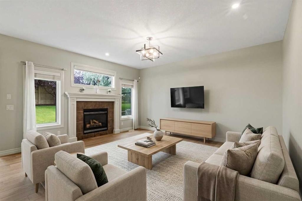 126 Chapman Close Se, Calgary, AB - Indoor Photo Showing Living Room With Fireplace