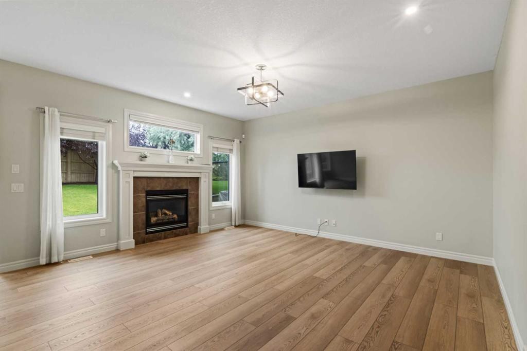 126 Chapman Close Se, Calgary, AB - Indoor Photo Showing Living Room With Fireplace