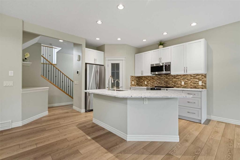 126 Chapman Close Se, Calgary, AB - Indoor Photo Showing Kitchen With Upgraded Kitchen