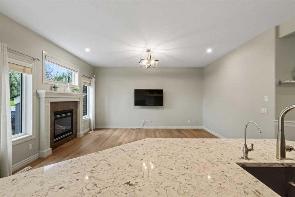 126 Chapman Close Se, Calgary, AB - Indoor Photo Showing Living Room With Fireplace