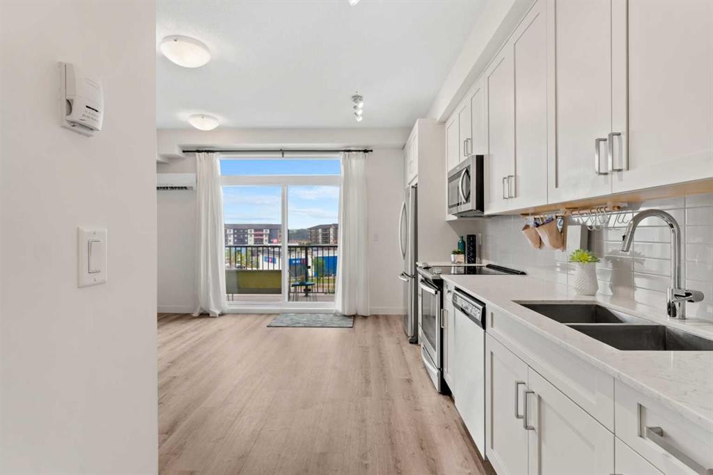 408-20 Walgrove Se, Calgary, AB - Indoor Photo Showing Kitchen With Double Sink With Upgraded Kitchen
