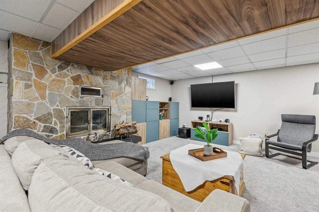 241 Allan Crescent Se, Calgary, AB - Indoor Photo Showing Basement With Fireplace