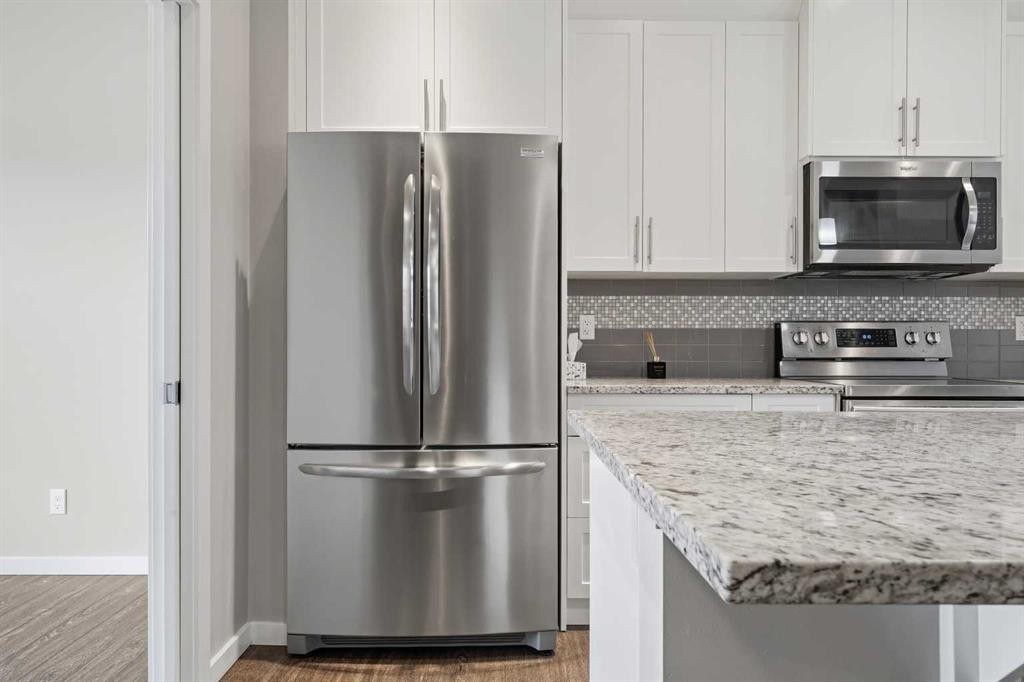 75 Legacy Glen Row Se, Calgary, AB - Indoor Photo Showing Kitchen With Stainless Steel Kitchen With Upgraded Kitchen