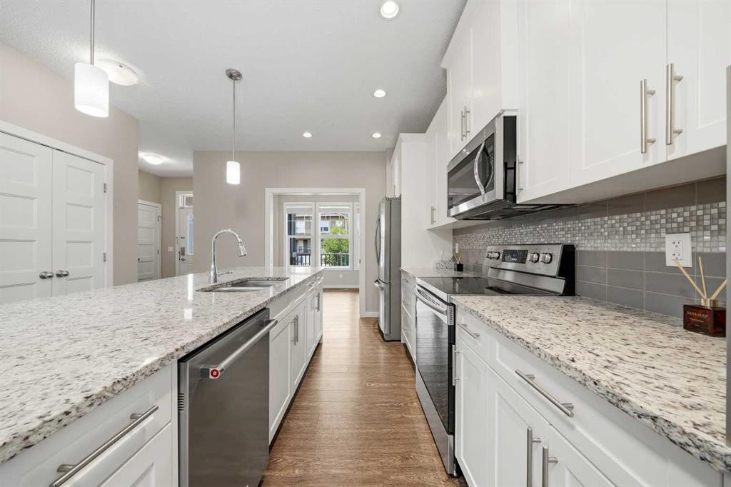 75 Legacy Glen Row Se, Calgary, AB - Indoor Photo Showing Kitchen With Stainless Steel Kitchen With Upgraded Kitchen