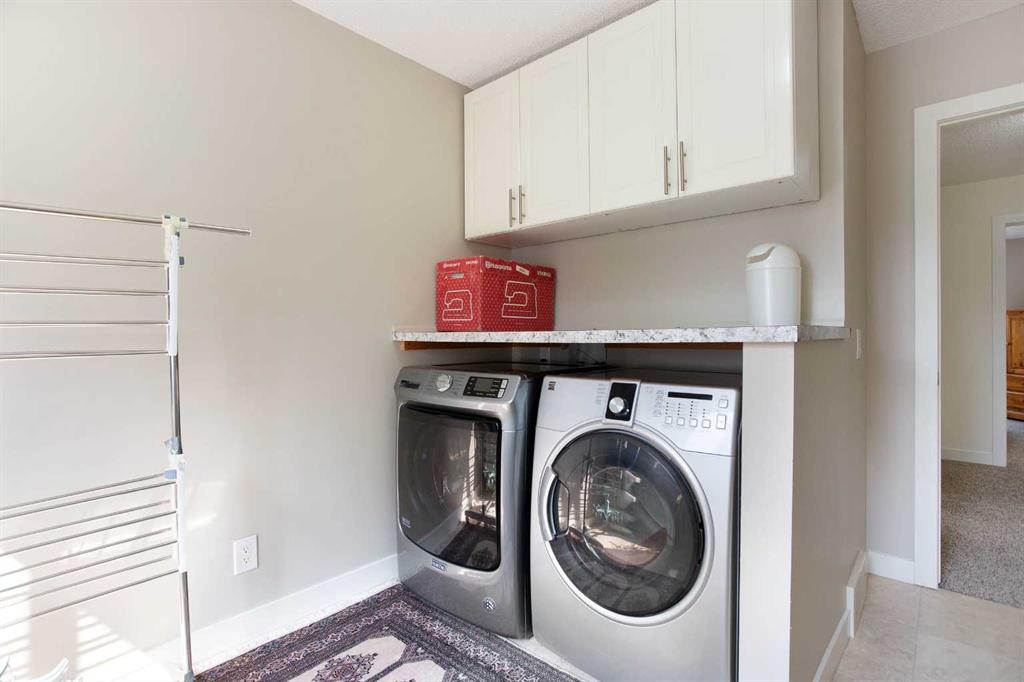 24 Sun Harbour Place Se, Calgary, AB - Indoor Photo Showing Laundry Room