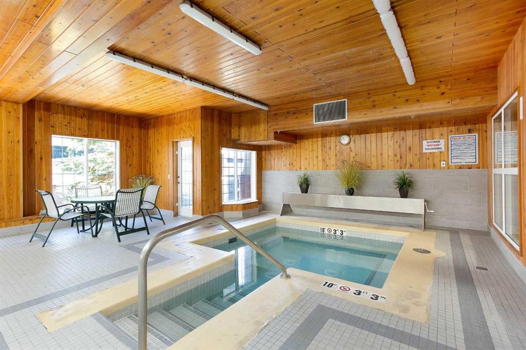 239-8535 Bonaventure Drive Se, Calgary, AB - Indoor Photo Showing Other Room With In Ground Pool