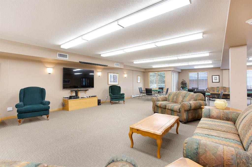 239-8535 Bonaventure Drive Se, Calgary, AB - Indoor Photo Showing Living Room