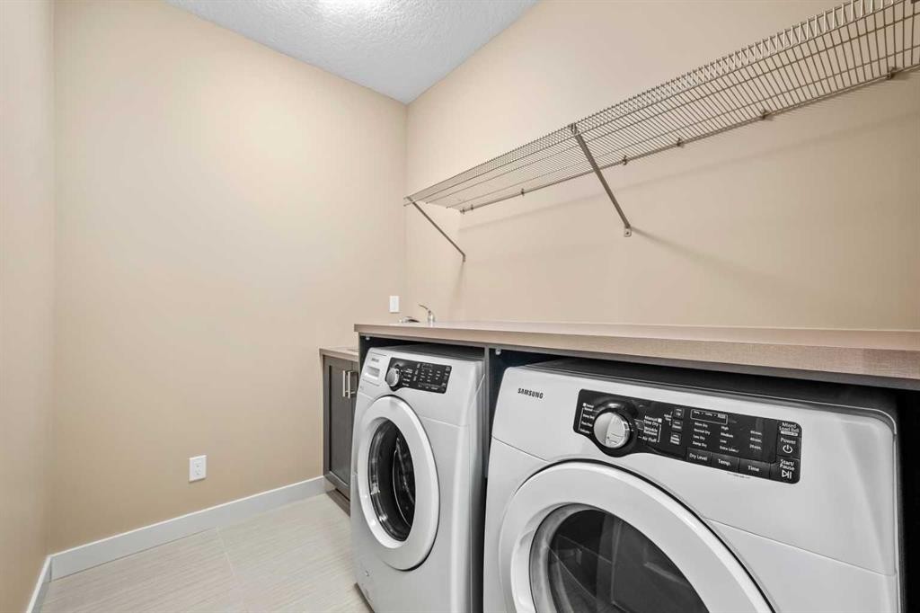 63 Cortina Villas Sw, Calgary, AB - Indoor Photo Showing Laundry Room