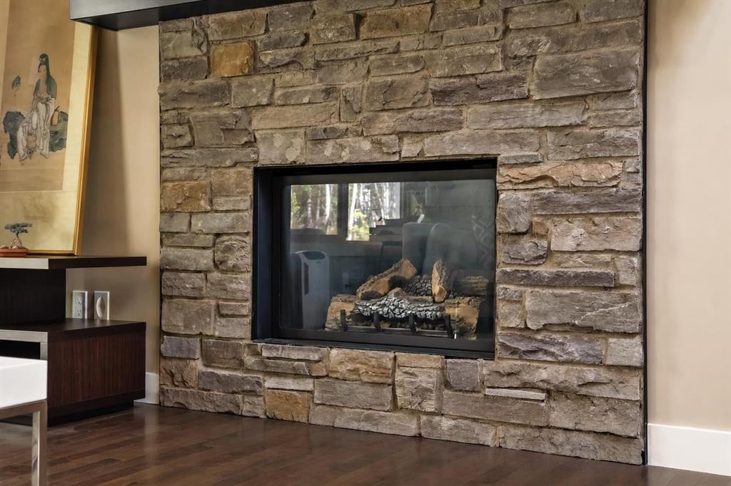 63 Cortina Villas Sw, Calgary, AB - Indoor With Fireplace